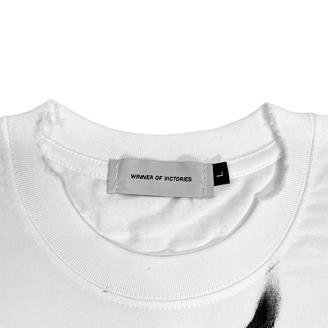 Close-up of a white shirt with a label on a white background