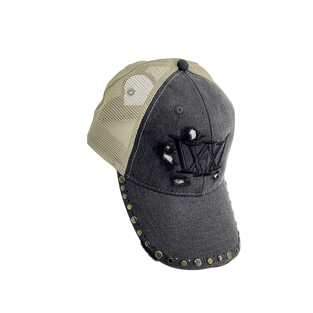 Gray and beige cap with decorative elements on a white background