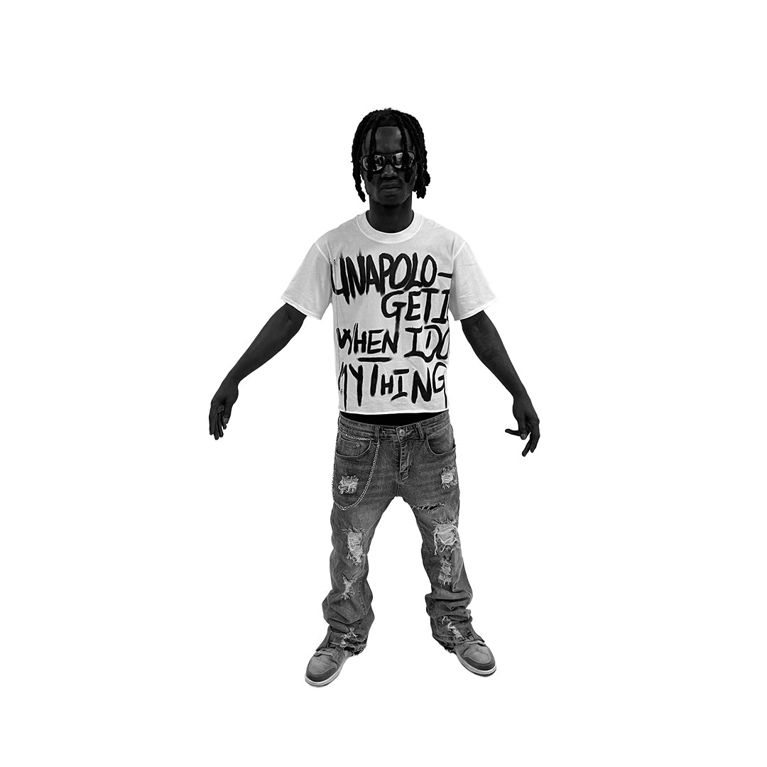 Person wearing a white t-shirt with text and gray jeans on a white background