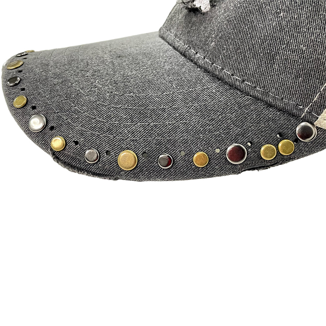 Gray denim cap with colorful studs on a white background